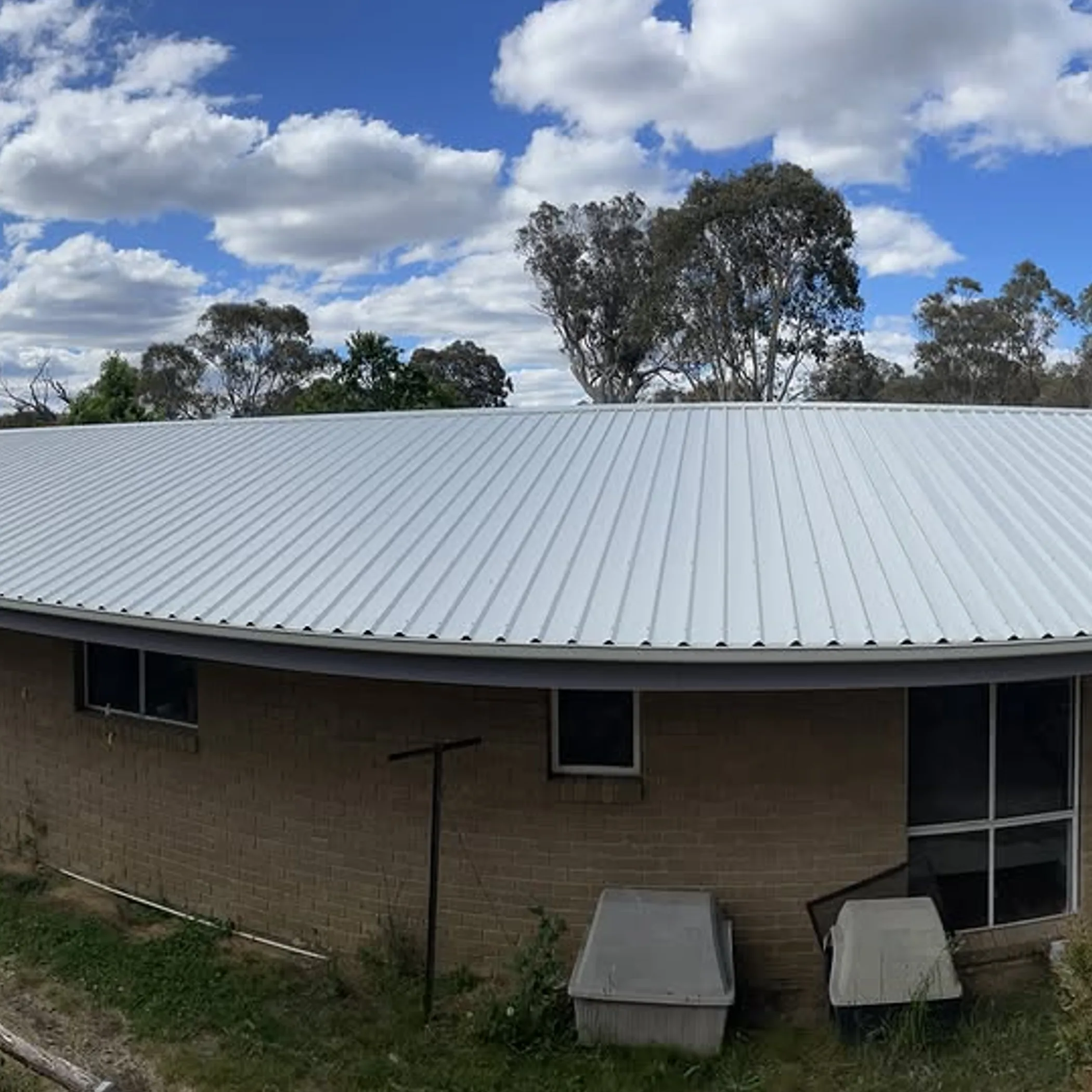 metal roof with gutters and downpipes